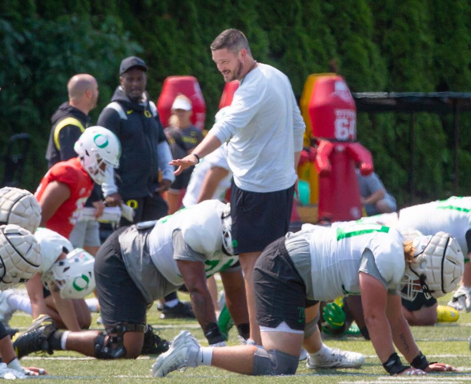 Oregon head football coach Dan Lanning, center, leads practice during the second week of fall camp for the 2022 season Aug. 8, 2022.