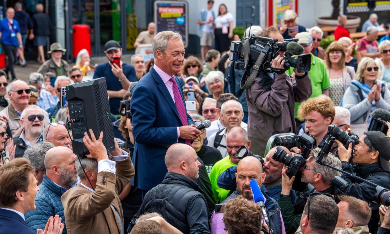 <span>Nigel Farage speaks to supporters as he launches his election candidacy at Clacton Pier on 4 June in Clacton-on-Sea.</span><span>Photograph: Jill Mead/The Guardian</span>