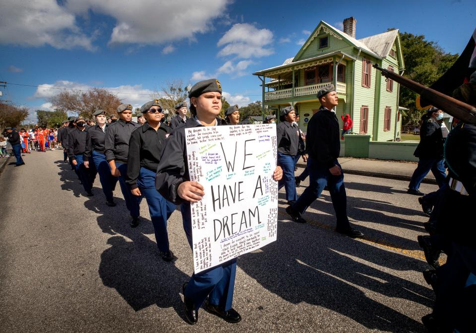 Cadets in the Summerlin Institute program march past the L.B. Brown house during the Martin Luther King parade in Bartow  Fl. Monday January 17 ,  2021.  
ERNST PETERS/ THE LEDGER