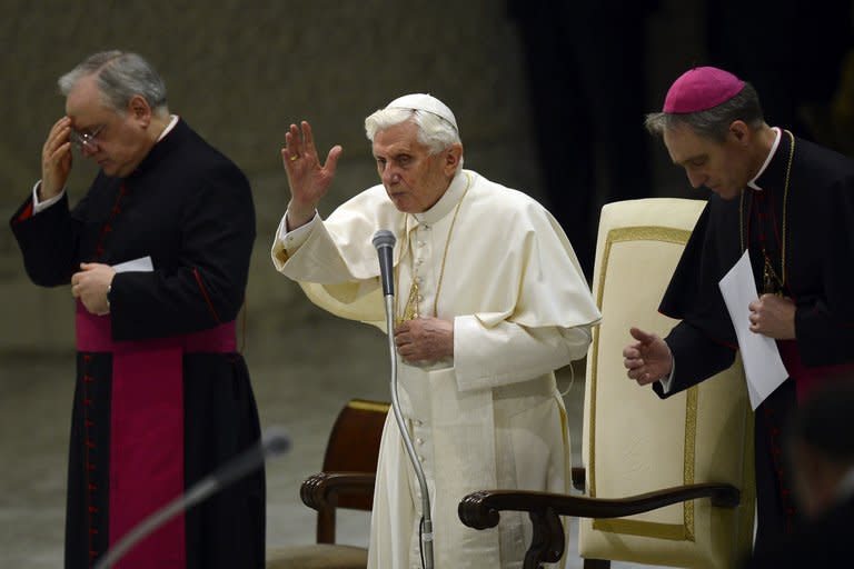 Pope Benedict XVI blesses the faithful during his weekly general audience in the Vatican on January 23, 2013