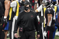 Atlanta Falcons head coach Dan Quinn watches play against the Carolina Panthers during the first half of an NFL football game, Sunday, Oct. 11, 2020, in Atlanta. (AP Photo/Brynn Anderson)