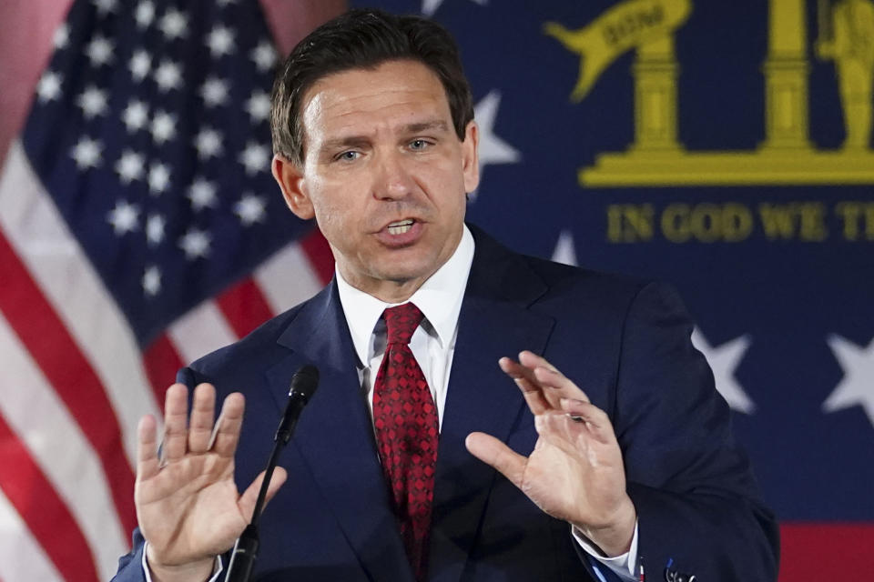 FILE - Florida Gov. Ron DeSantis speaks to a crowd at Adventure Outdoors gun store, Thursday, March 30, 2023, in Smyrna, Ga. DeSantis has proposed legislation this year to ban diversity, equity and inclusion offices as part of a broader agenda to reshape higher education. (AP Photo/John Bazemore, File)