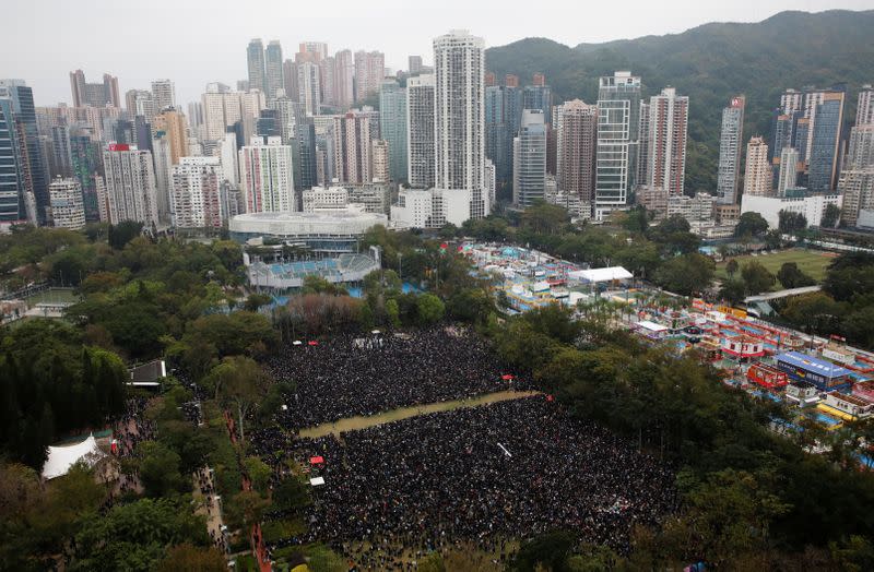Anti-government protesters attend a demonstration on New Year's Day to call for better governance and democratic reforms in Hong Kong