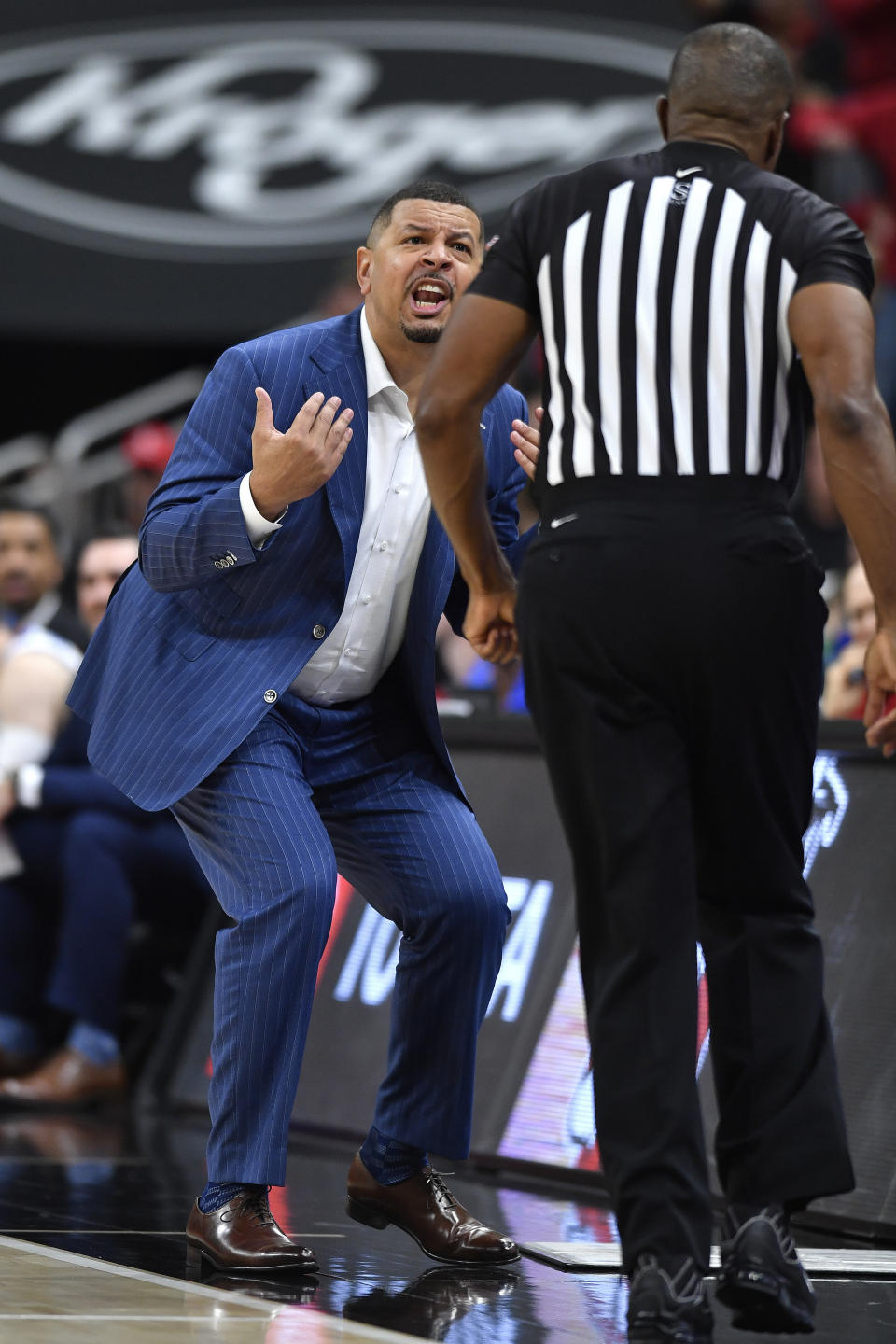 Pittsburgh head coach Jeff Capel, left, reacts to referee Ted Valentine after receiving a technical foul during the second half of an NCAA college basketball game in Louisville, Ky., Friday, Dec. 6, 2019. (AP Photo/Timothy D. Easley)