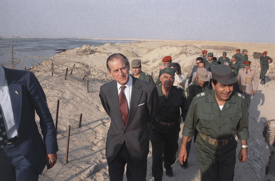 FILE - In this 1981 file photo, Britain’s Prince Philip visits the remnants of the Bar-Lev line in Egypt in 1981. Buckingham Palace officials say Prince Philip, the husband of Queen Elizabeth II, has died, it was announced on Friday, April 9, 2021. He was 99. Philip spent a month in hospital earlier this year before being released on March 16 to return to Windsor Castle. Philip, also known as the Duke of Edinburgh, married Elizabeth in 1947 and was the longest-serving consort in British history. (AP Photo/Bill Foley, File)
