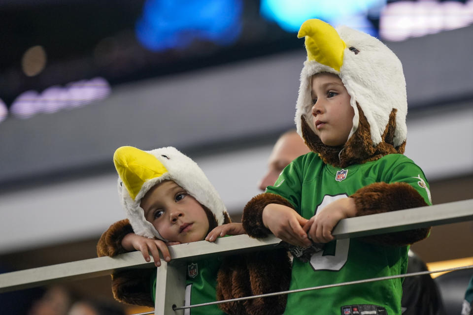 Young Philadelphia Eagles fans look on during the second half of an NFL football game between the Dallas Cowboys and the Eagles, Sunday, Dec. 10, 2023, in Arlington, Texas. (AP Photo/Sam Hodde)