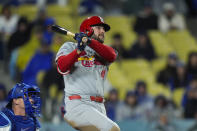 St. Louis Cardinals' Alec Burleson watches after hitting an RBI single against the Los Angeles Dodgers during the seventh inning of a baseball game Saturday, March 30, 2024, in Los Angeles. (AP Photo/Jae C. Hong)