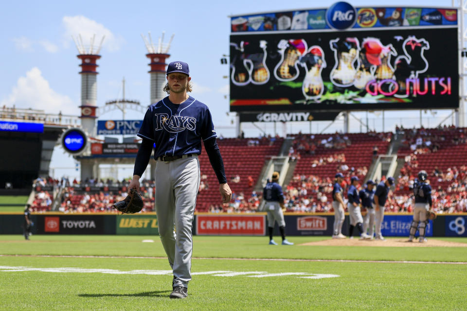 Tampa Bay Rays' Shane Baz walks to the dugout after being pulled from the game during the third inning of a baseball game against the Cincinnati Reds in Cincinnati, Sunday, July 10, 2022. (AP Photo/Aaron Doster)