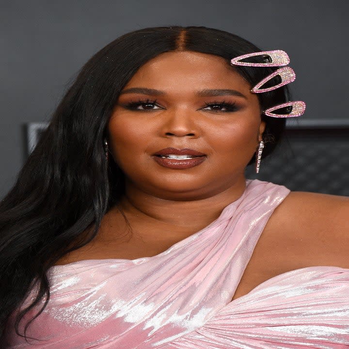 Lizzo in a one-shoulder gown at a red carpet event