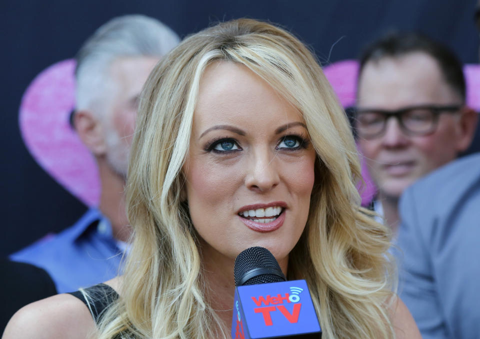 FILE - In this May 23, 2018 file photo Stormy Daniels, speaks during a ceremony for her receiving a City Proclamation and Key to the City in West Hollywood, Calif. A federal judge will consider Monday, Sept. 24, whether to toss out a lawsuit brought by Daniels against President Donald Trump and his former lawyer, Michael Cohen, weeks after Trump conceded a non-disclosure deal she signed just before the 2016 presidential election is invalid. (AP Photo/Ringo H.W. Chiu, File)