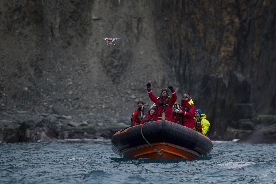 Yang Liu and Vikrant Shah, from North Eastern University, launch a drone from a Greenpeace inflatable. They will later use machine learning to do an automated count of penguin colonies on Elephant Island. The drone counts are later compared to the manual counts done by another team of scientists. | Christian Åslund —Greenpeace and TIME