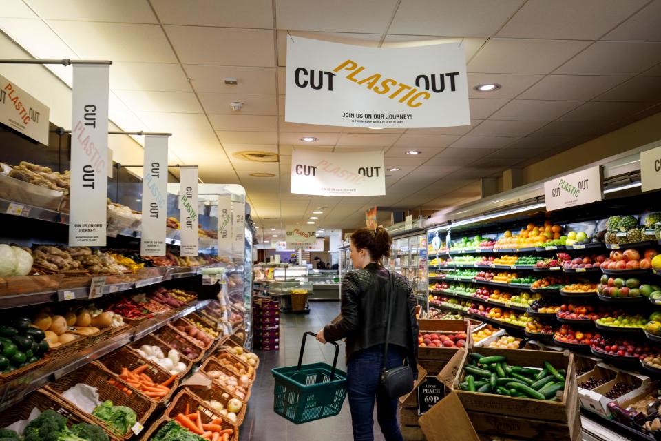 Signs promoting plastic packaging free products at Budgens supermarket in Belsize Park, north London. Photo: Tolga Akmen/AFP/Getty