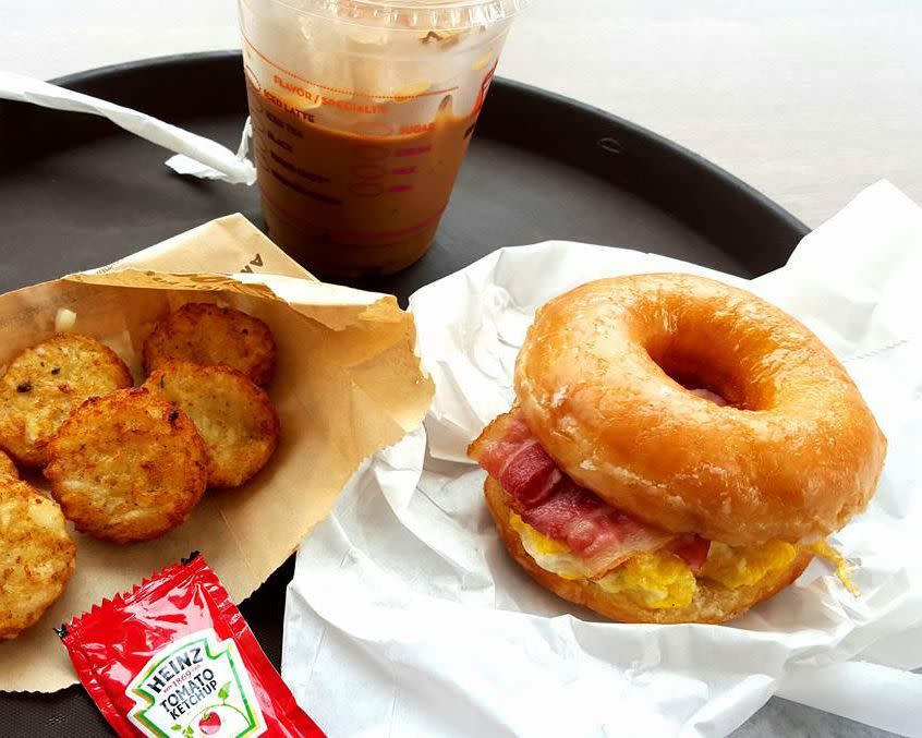 glazed donut breakfast sandwich and hash browns and iced coffee, dunkin' donuts