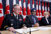 Canada's Chief of the Defence Staff General Jonathan Vance (L) speaks during a news conference with Defence Minister Harjit Sajjan (C) and Public Works Minister Carla Qualtrough in Ottawa, Ontario, Canada, December 12, 2017. REUTERS/Chris Wattie