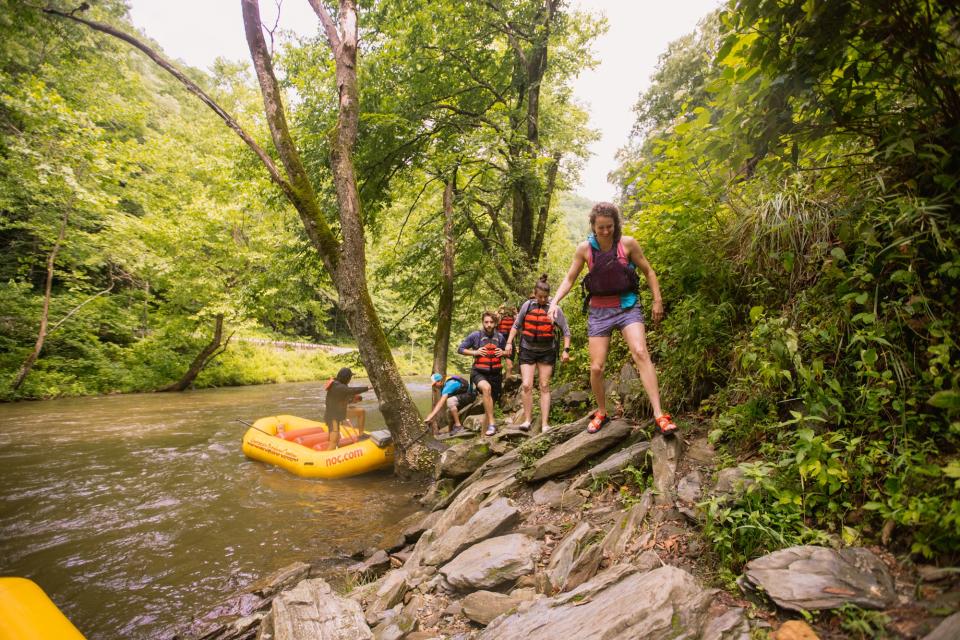 Jump Off Rock on the Nantahala River in Swain County can be accessed by a pull-off on U.S. 74 or on a raft trip with the Nantahala Outdoor Center.