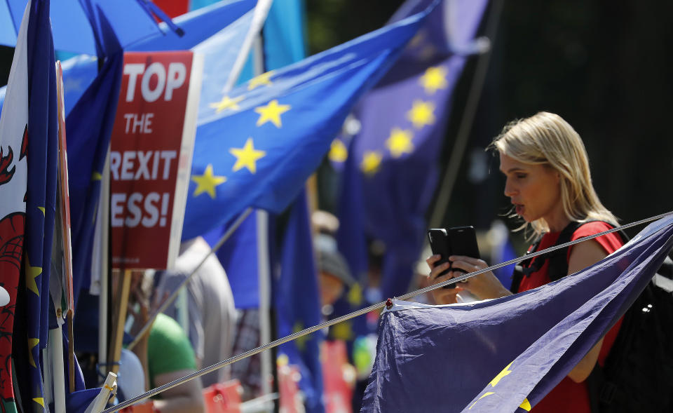 Anti-Brexit protestors in London, Tuesday, July 23, 2019. Brexit champion Boris Johnson was announced Tuesday as winner in the contest to lead Britain’s governing Conservative Party, and to become the country’s next prime minister. (AP Photo/Frank Augstein)