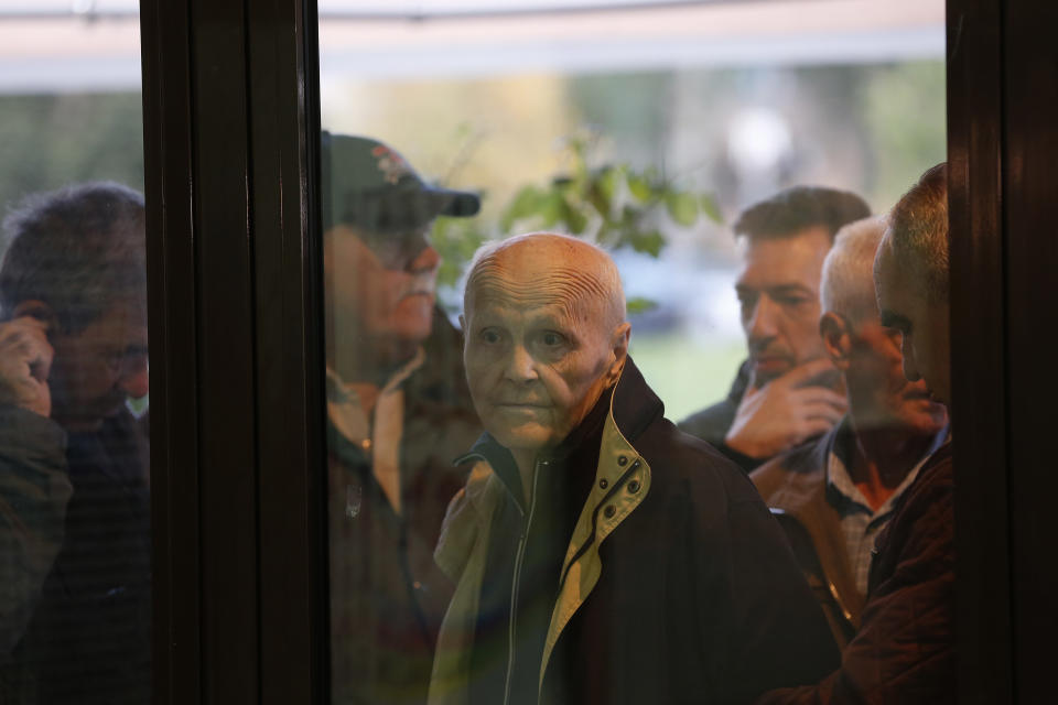 Bosnian people wait in a line to cast their vote at poling station in Sarajevo, Bosnia, on Sunday, Oct. 7, 2018. Polls have opened in Bosnia for a general election that could install a pro-Russian nationalist to a top post and cement ethnic divisions drawn in a brutal war more than 20 years ago. Sunday's vote is seen as a test of whether Bosnia will move toward integration in the European Union and NATO or remain entrenched in war-era rivalries.(AP Photo/Amel Emric)