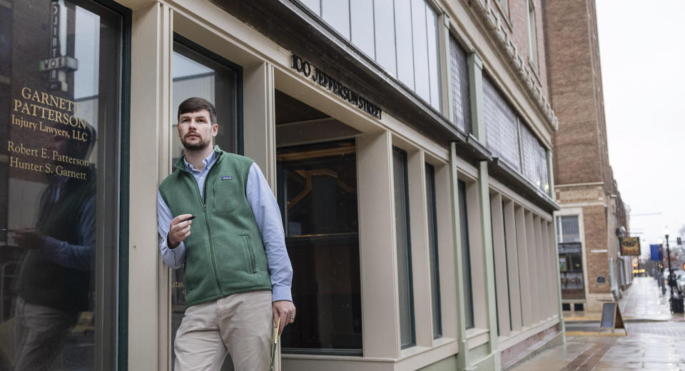 Hunter Garnett, of Garnett Patterson Injury Lawyers, poses outside his law office near the Madison County courthouse, Thursday, Jan. 25, 2024, in Huntsville, Ala. Garnett is seeking a smaller office space in the suburbs closer to his clients, rather than the large space he has now. (AP Photo/Vasha Hunt)