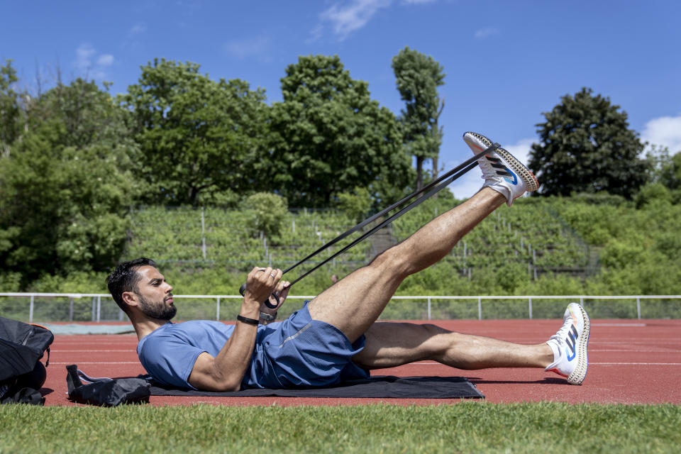 Syrian refugee Mohammad Amin Alsalami, 29, trains at the Wilmersdorf Stadium in Berlin on May 29, 2024. After leaving his war-torn hometown of Aleppo, he made it by foot to Germany through Turkey, Greece and the Balkans in October 2015. After almost a decade, he is thriving. He was granted asylum, has learned German, made new friends, and will now compete in Paris as part of the Refugee Olympic Team. (AP Photo/Ebrahim Noroozi)