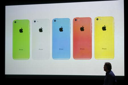 The five colors of the new iPhone 5C are seen on screen at Apple Inc's media event in Cupertino, California September 10, 2013. REUTERS/Stephen Lam