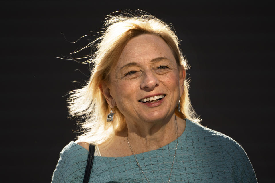 FILE- Gov. Janet Mills walks in Bath, Maine, in this Nov. 7, 2022, file photo. Mills has been writing poetry since the the 1960s. "Poetry and reading are a way of learning the world and opening our eyes and ears to what other people are experiencing," she said. (AP Photo/Robert F. Bukaty)