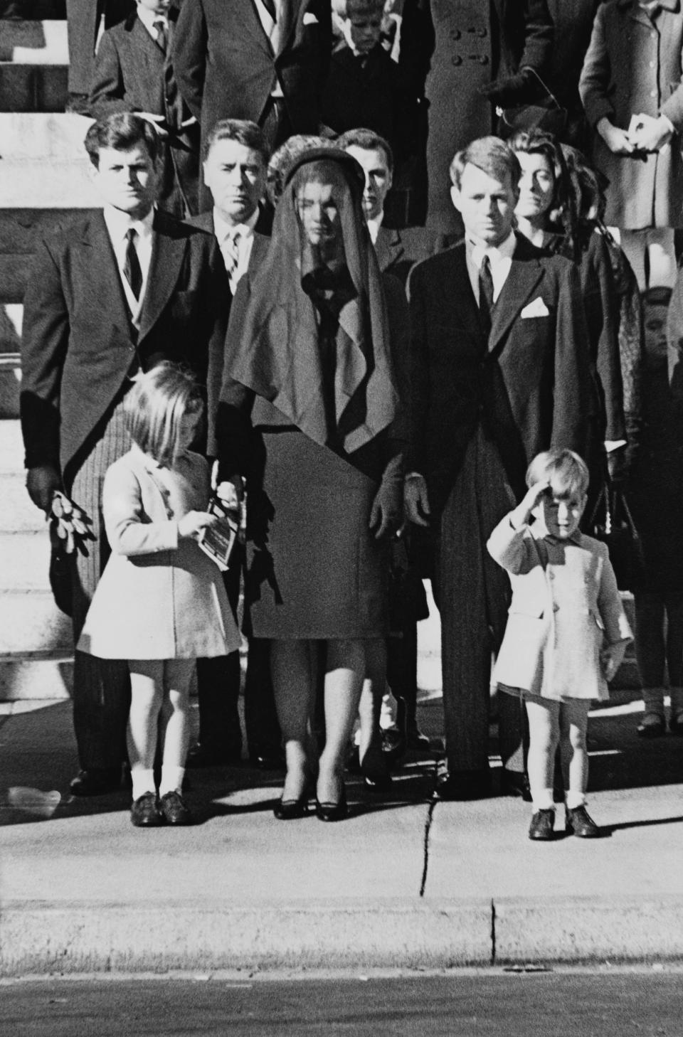 Members of the Kennedy family at the funeral of assassinated president John F. Kennedy at Washington DC. From left: Senator Edward Kennedy, Caroline Kennedy, (aged 6), Jackie Kennedy (1929 - 1994), Attorney General Robert Kennedy and John Kennedy (1960 - 1999) (aged 3).
