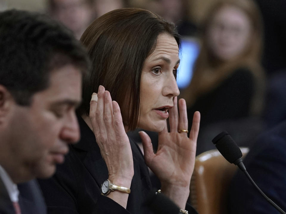 Former White House national security aide Fiona Hill, and David Holmes, right, a U.S. diplomat in Ukraine, testify before the House Intelligence Committee on Capitol Hill in Washington, Thursday, Nov. 21, 2019, during a public impeachment hearing of President Donald Trump's efforts to tie U.S. aid for Ukraine to investigations of his political opponents. (AP Photo/J. Scott Applewhite)
