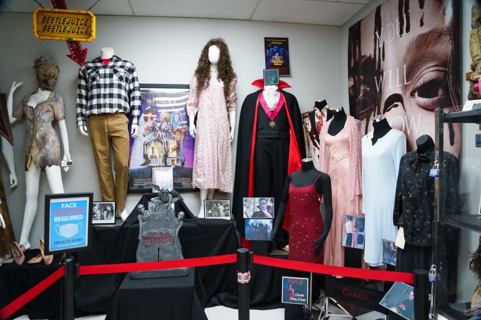 Costumes and scary movie memorabilia on display at Spooky's Swirls Gluten Free Bakery on Oct. 28, 2022, in Chandler, Ariz.