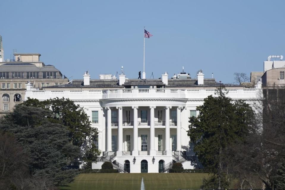 An American flag flies above the White House in Washington, Saturday, Jan. 9, 2021. (AP Photo/Patrick Semansky)