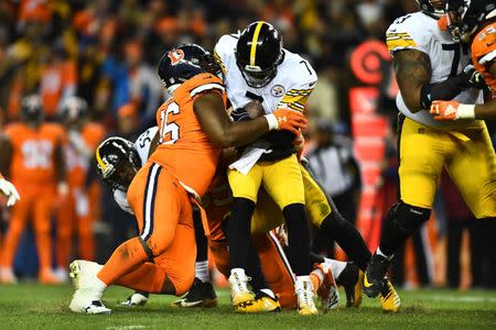 Nov 25, 2018; Denver, CO, USA; Pittsburgh Steelers quarterback Ben Roethlisberger (7) is sacked by Denver Broncos defensive end Shelby Harris (96) in the fourth quarter at Broncos Stadium at Mile High. Mandatory Credit: Ron Chenoy-USA TODAY Sports