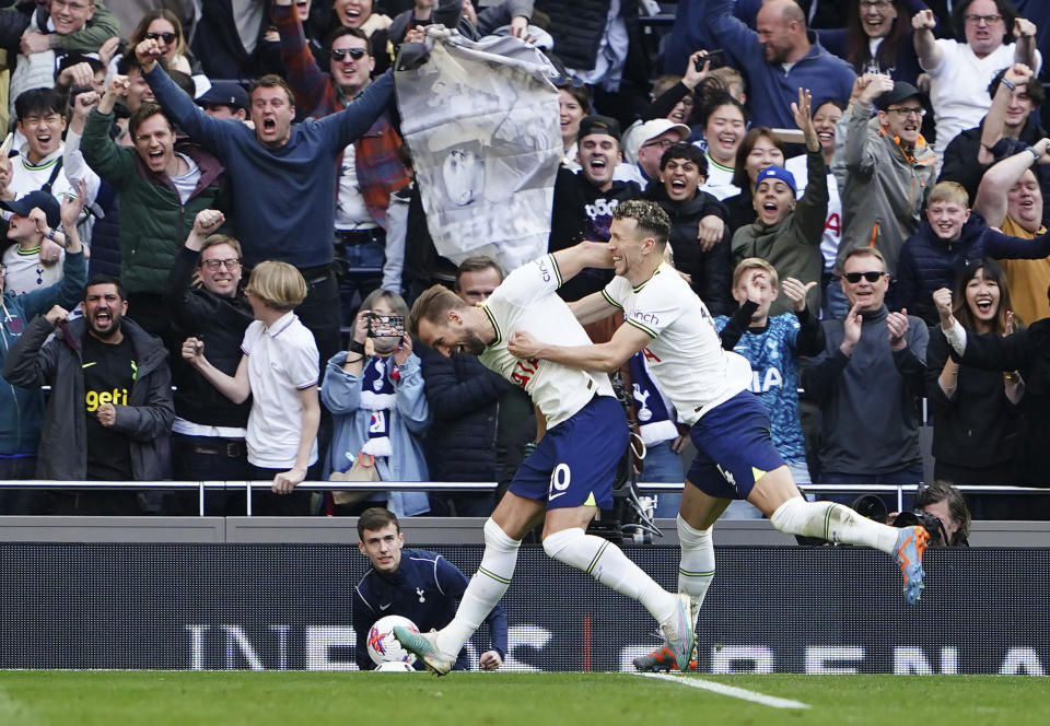 Tottenham Hotspur's Harry Kane, centre, celebrates scoring his side's second goal of the game , during the English Premier League soccer match between Tottenham Hotspur and Brighton & Hove, at the Tottenham Hotspur Stadium, in London, Saturday April 8, 2023. (Zac Goodwin/PA via AP)