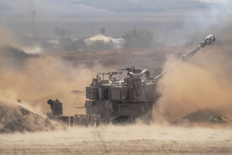 An Israeli 155mm self-propelled Howitzer canon fires into the Gaza Strip from a staging area in southern Israel not far from the border with the Gaza Strip on October 11. Photo by Jim Hollander/UPI