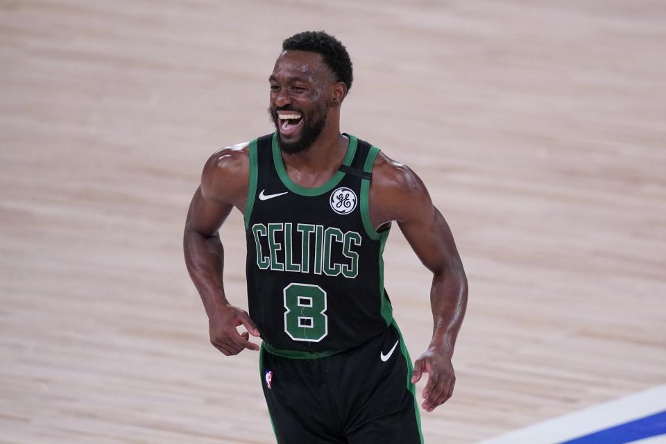 Boston Celtics guard Kemba Walker (8) celebrates after sinking a basket late in the second half of an NBA conference final playoff basketball game against the Miami Heat on Thursday, Sept. 17, 2020, in Lake Buena Vista, Fla. (AP Photo/Mark J. Terrill)