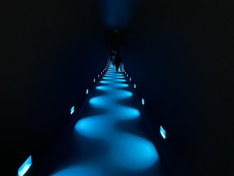 dark hallway lit up by blue lights