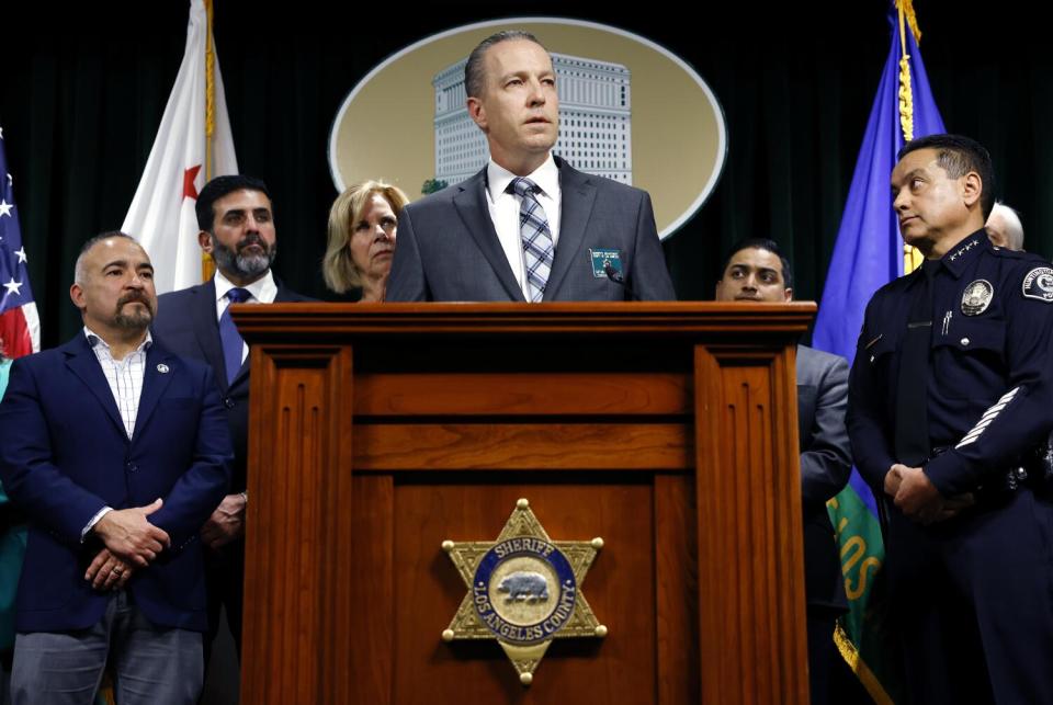 L.A. County and city officials and law enforcement from Bell and Huntington.