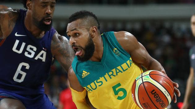 Patty Mills gets around the defence during the Boomers hard-fought loss to USA.