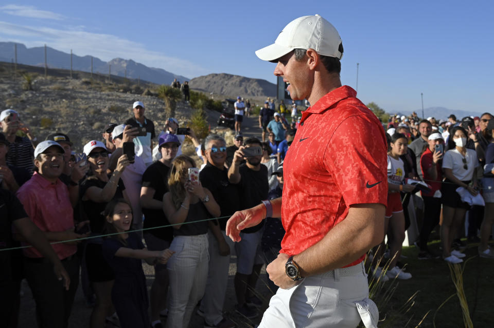 Rory McIlroy, of Northern Ireland, walks by fans after winning the CJ Cup golf tournament Sunday, Oct. 17, 2021, in Las Vegas. (AP Photo/David Becker)