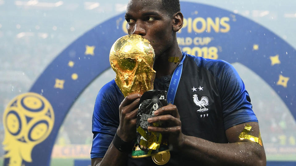 Pogba shares a touching moment with the trophy and his shinpad after the 2018 FIFA World Cup Final between France and Croatia. Pic: Getty