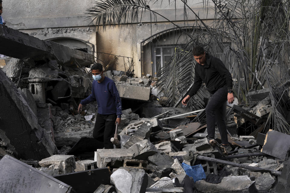 Palestinians inspect the rubble of Islamic Jihad member Anas Al Massri's house after it was hit by an Israeli airstrike last night in Beit Lahiya, northern Gaza Strip, Thursday, May 11, 2023. (AP Photo/Adel Hana)