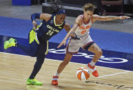 Dallas Wings guard Arike Ogunbowale deflects the ball away from Connecticut Sun guard Natisha Hiedeman during a WNBA basketball game Tuesday, June 22, 2021 at Mohegan Sun Arena in Uncasville, Conn. (Sean D. Elliot/The Day via AP)