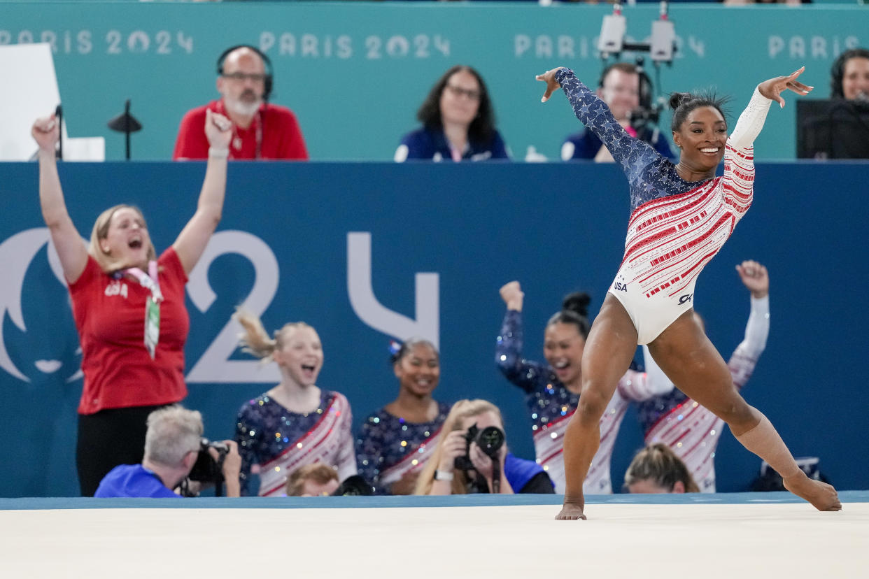 Simone Biles ends her floor routine as the rest of the team cheer behind her during the women's artistic gymnastics team finals round at the 2024 Summer Olympics, July 30, in Paris, France. (Natacha Pisarenko/AP)