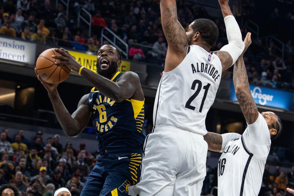 Jan 5, 2022; Indianapolis, Indiana, USA; Indiana Pacers guard Lance Stephenson (6) shoots the ball while Brooklyn Nets center LaMarcus Aldridge (21) defends  in the first half at Gainbridge Fieldhouse.