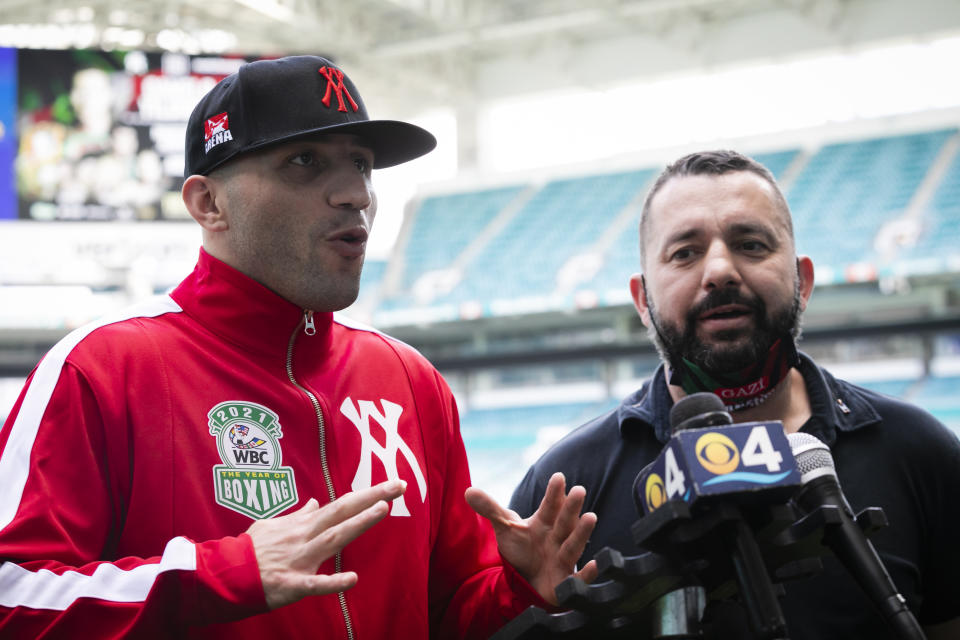 FLORIDA, USA - FEBRUARY 22: Professional boxer Avni Yildirim (L) speaks during a press conference prior to the boxing match, which will be held on Feb. 27, against Saul Alvarez of Mexico who currently holds World Boxing Association (WBA) and World Boxing Council (WBC) super middleweight belts, at Hard Rock Stadium, in Miami, Florida, United States on February 22, 2021. (Photo by Eva Marie Uzcategui Trinkl/Anadolu Agency via Getty Images)