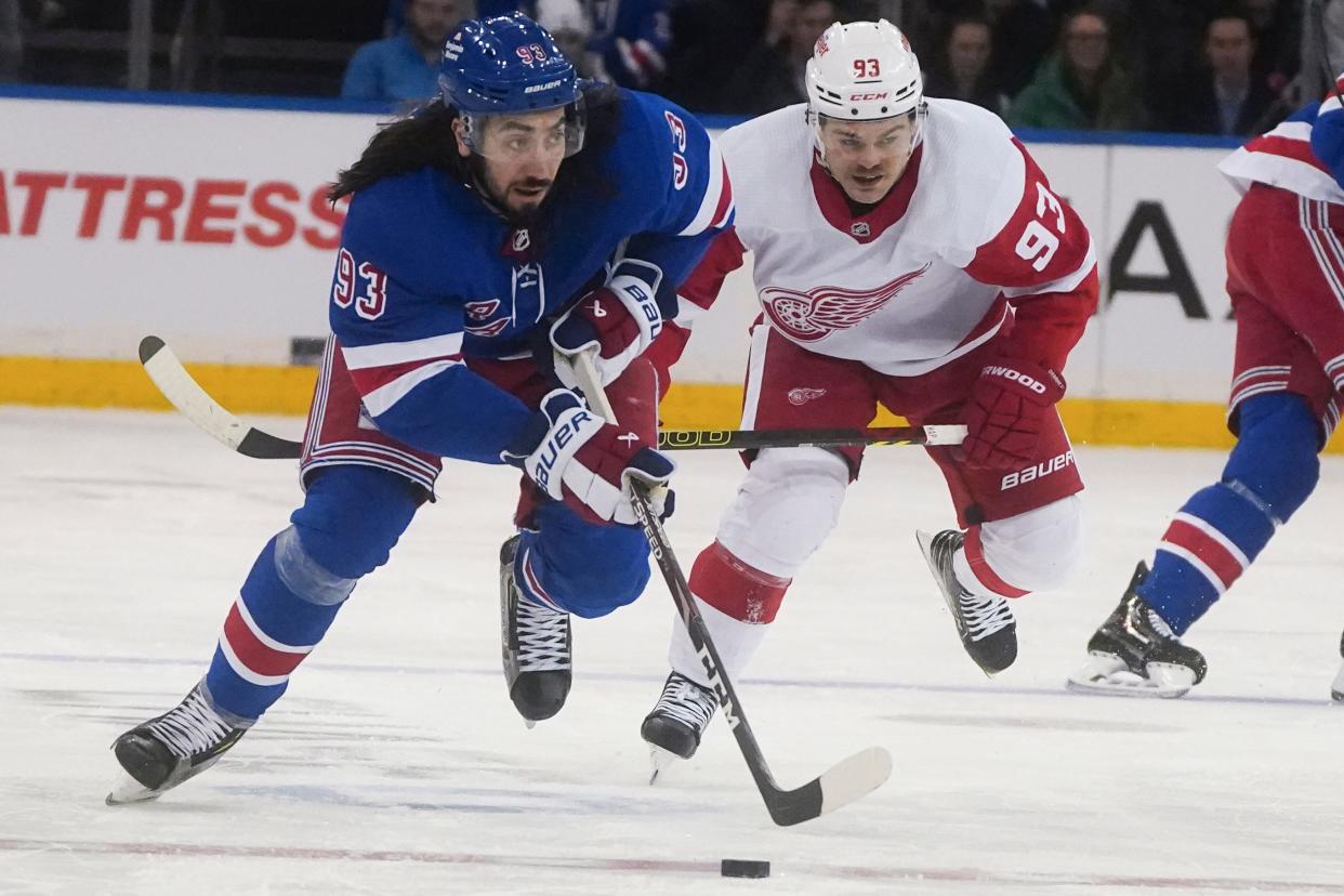 New York Rangers' Mika Zibanejad, left, breaks away from Detroit Red Wings' Alex DeBrincat during the second period of an NHL hockey game, Wednesday, Nov. 29, 2023, in New York.