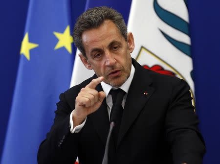 Former French President Nicolas Sarkozy gestures as he delivers a speech during the inauguration of the Institut Claude Pompidou, a new center for care and research of Alzheimer disease, in Nice March 10, 2014. REUTERS/Eric Gaillard