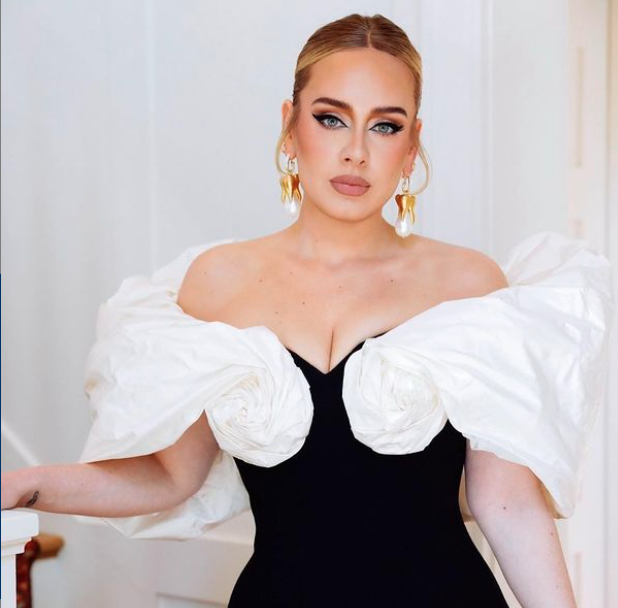 British pop singer Adele wearing a black and white dress in a photoshoot for British Vogue November 2021