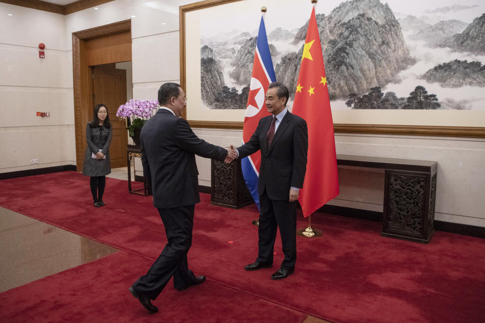 North Korean Foreign Minister Ri Yong Ho, center, meets China's Foreign Minister Wang Yi at the Diaoyutai State Guesthouse in Beijing Friday, Dec. 7, 2018. (Fred Dufour/Pool Photo via AP)