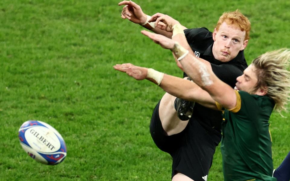 South Africa's Faf de Klerk charges down a kick from New Zealand's Finlay Christie