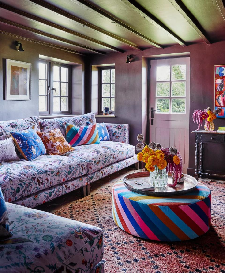 a living room with a couch and a rug