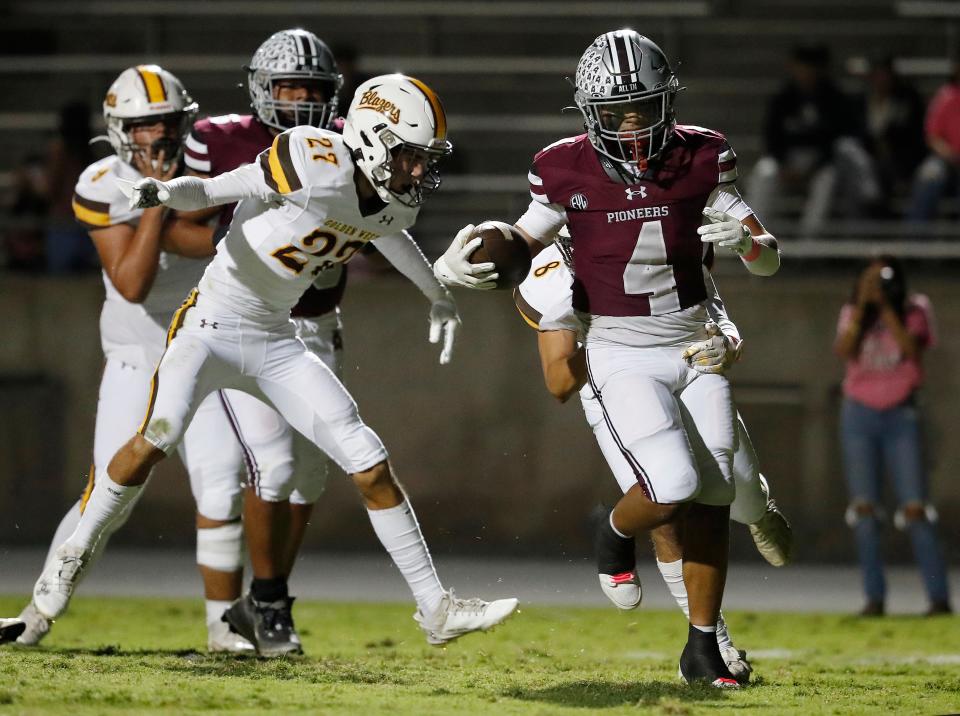 Mt. Whitney's Kysen Sing Galvizo runs in for a touchdown against Golden West during their high school football game at Mineral King Bowl in Visalia, Calif., Friday, Oct. 6, 2023.